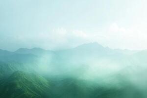 Misty mountain range. Lush green hills veiled in soft morning mist photo