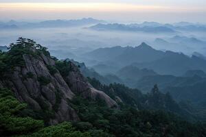 Misty mountain range at dawn photo