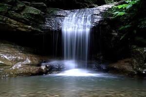 Cascading waterfall in a secluded forest photo