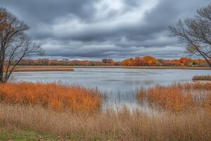 Autumnal lake vista under a stormy sky photo