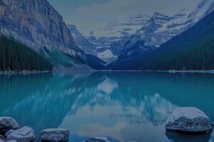 Serene mountain lake reflecting a tranquil sky photo