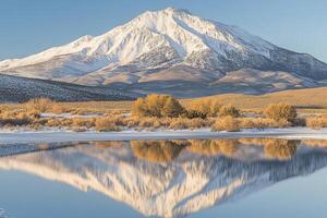 Majestic mountain peak reflected in serene lake photo