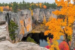 Autumnal rock formations and a serene lake photo