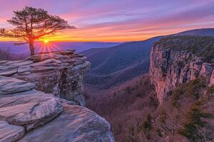 Sunrise over rocky precipice photo