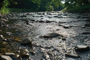 Clear, swift creek flowing over rocks photo