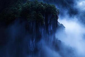 Misty mountain peak shrouded in a tranquil fog photo