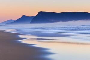 Misty Sunrise Beach Scene photo