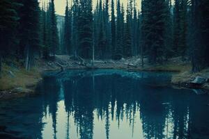 Serene mountain pond reflecting tall pines photo