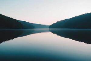 Serene lake at dawn, mirrored landscape photo