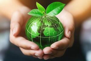 Green Earth held gently in hands photo