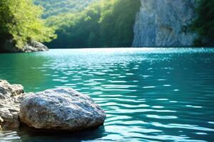 A rock sits in the middle of a lake photo