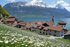 Alpine village nestled beside a lake, blanketed in wildflowers photo