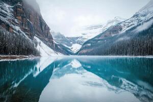 Serene winter lake nestled in majestic mountains photo