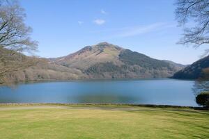 Scenic lake view with mountain backdrop photo