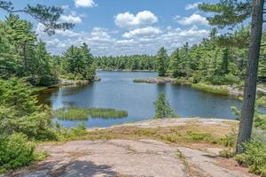 Serene lake vista from a rocky outcrop photo