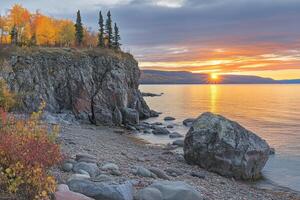 Autumnal Lakeside Cliff at Sunrise photo