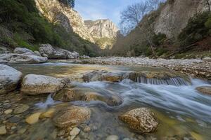 Mountain stream cascading over rocks photo