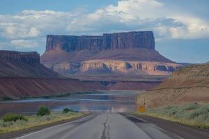 Desert highway leading to a mesa photo