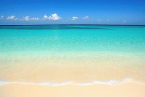 Tranquil turquoise ocean meets soft, sandy shore photo