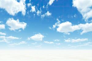 Sunny, cloud-filled sky over a vast white expanse photo