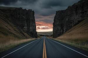 Dramatic Road Through Canyon at Dusk photo