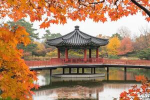Autumnal Japanese-style Pavilion over a pond photo