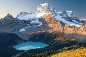 Majestic mountain peak, pristine alpine lake, and vibrant autumn colors photo