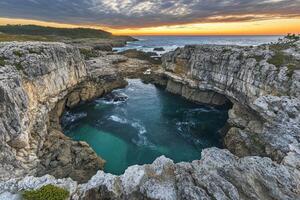 Dramatic coastal scene with a natural pool photo