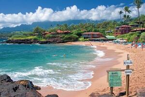 Tropical beach paradise with calm turquoise water, sandy shore, and lush vegetation. Coastal resort town nestled against the backdrop of volcanic mountains photo