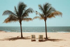 Tropical beach scene with two chairs photo