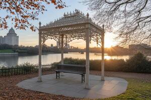 Sunrise over tranquil park gazebo photo