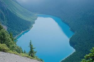 Serene alpine lake nestled in a valley photo