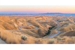 Winding Road Through Golden Hills at Dawn photo