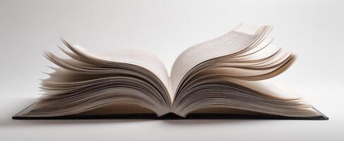 The open book showcasing its beautiful, well-loved pages on a minimalist background photo