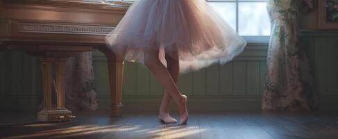 The graceful ballet dancer in a serene room near the piano. photo