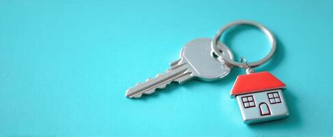 The keys and house charm representing new home ownership and security. photo