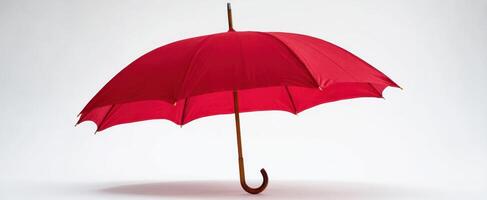 The elegant red umbrella standing proudly against a minimalistic backdrop. photo