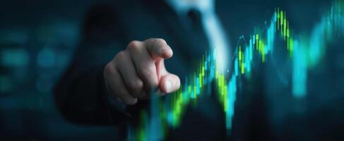 The businessman pointing at a digital growth chart in a futuristic setting. photo