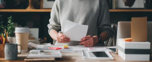 The creative workspace featuring documents and essential office supplies photo