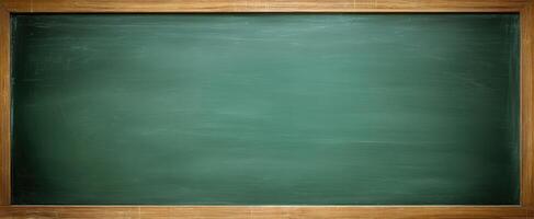 A blackboard with a wooden frame and chalk on it photo