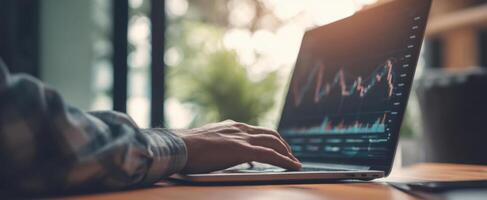 The laptop displaying financial analysis in a modern workspace setting. photo