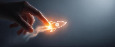The glowing rocket being launched from a hand, representing innovation and creativity. photo