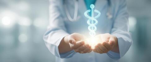 The doctor holding a holographic caduceus symbol of health and healing. photo