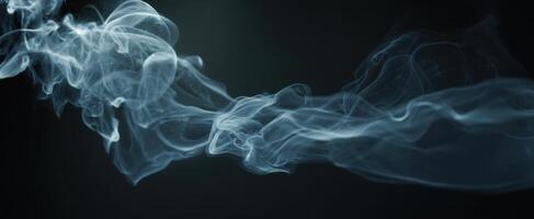 The graceful movement of smoke creating an ethereal and mysterious atmosphere. photo