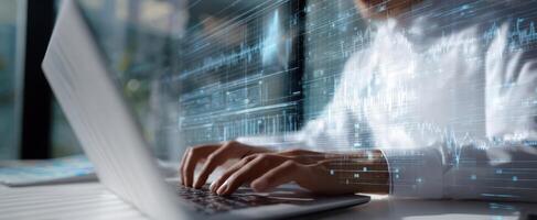 The business professional engaging with digital data on a modern laptop. photo