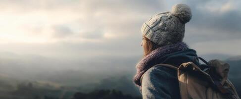 The traveler enjoying a scenic view from a mountain top. photo