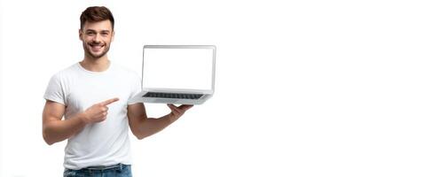 The smiling man showcasing a laptop with a blank screen for advertisement. photo