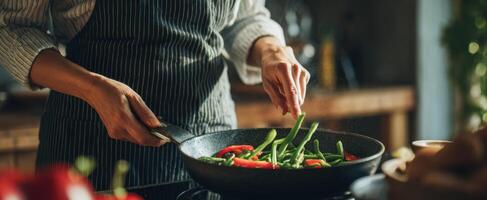 The Chef Stirring Fresh Vegetables in a Modern Kitchen Setting photo