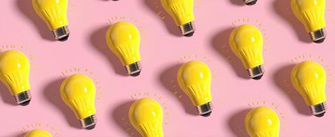 The yellow lightbulbs creating a vibrant pattern on a pink background. photo