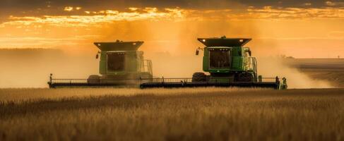 The Harvesters Working in a Golden Field at Sunset. photo
